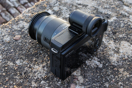 Canon EOS M6 Mark II mirrorless camera with external evf on stone