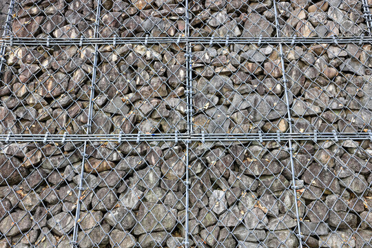 Gabion Wire Mesh Filled with Rocks, steel net as security against falling rocks.