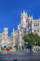 Obraz premium Cybele Palace in Madrid, Spain, former Palace of Communication. Neoplateresque architecture, sunny day, clear blue sky
