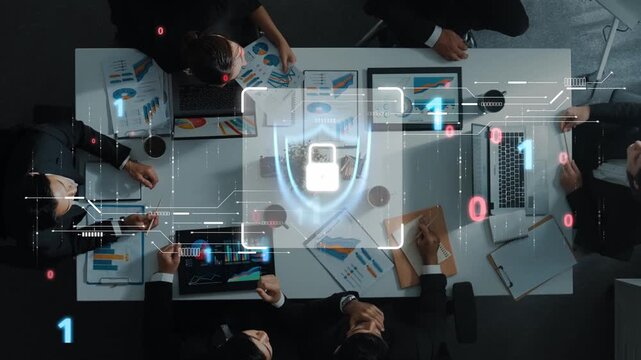 A group of professionals in a corporate meeting, analyzing data security strategies. Digital visuals emphasize connectivity and protection in a modern workspace. Raster