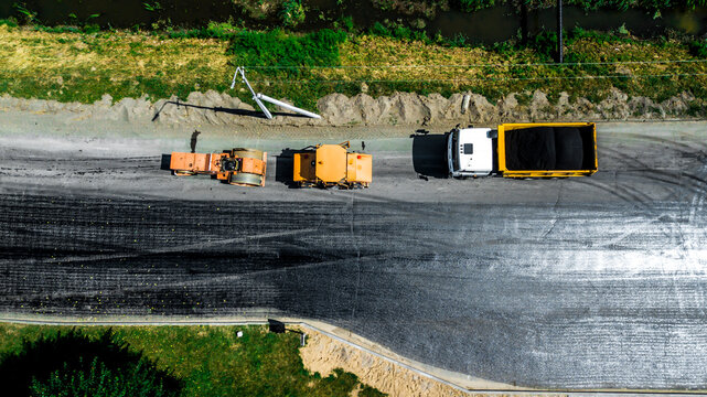 Aerial view on the new asphalt road under construction