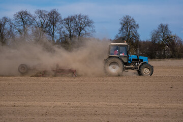 Fototapeta premium tractor plowing the field. Agriculture. Land cultivation