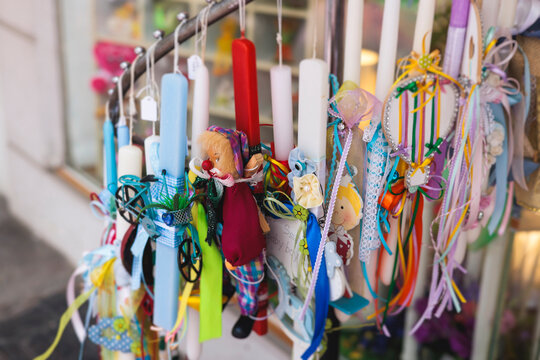 Greek Easter candles, assortment selection of handmade crafted traditional lambada, multicoloured wax candles with ribbon for sale in local store market, Orthodox Easter traditions in Athens, Greece