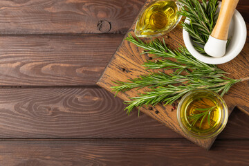 Culinary rosemary oil in a glass bottle with green rosemary sprigs, aromatic oil for cooking. Homemade rosemary oil, natural seasoning for cooking. Organic spiced oil. Herbs. Aromatherapy. Healthy © Avocado_studio