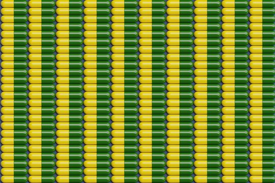 Yellow and green pills on blue surface. Top flat view