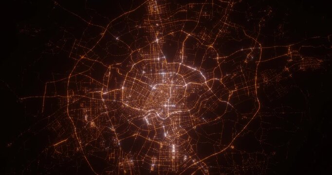 Shenyan (China) aerial view at night. Top view on modern city with street lights. Camera is flying above the city, moving backward