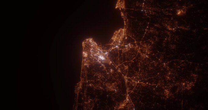Haifa (Israel) aerial view at night. Satellite view on modern city with street lights. Camera is flying above the city, moving forward