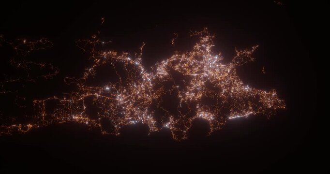 Phuket (Thailand) aerial view at night. Top view on modern city with street lights. Camera is zooming out, rotating counterclockwise. Vertical video. The north is on the left side