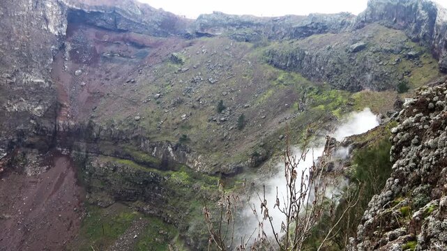 Fumaroles smoking inside the Vesuvius volcano crater