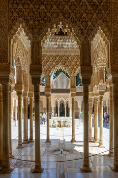 Intricate arches and columns in Alhambra Palace courtyard, Granada, Spain