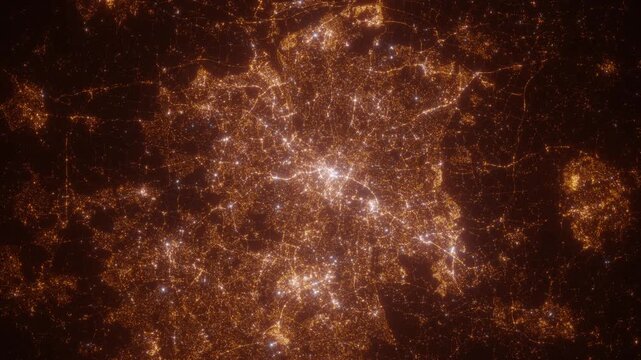Birmingham (United Kingdom) top view at night. Aerial view on modern city with lights. Camera is flying above the city, moving backward. Vertical video. The north is on the left side