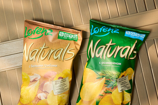 Tyumen, Russia-December 20, 2025: Lorenz Bag of chips on a wooden surface with natural ingredients from a well-known company