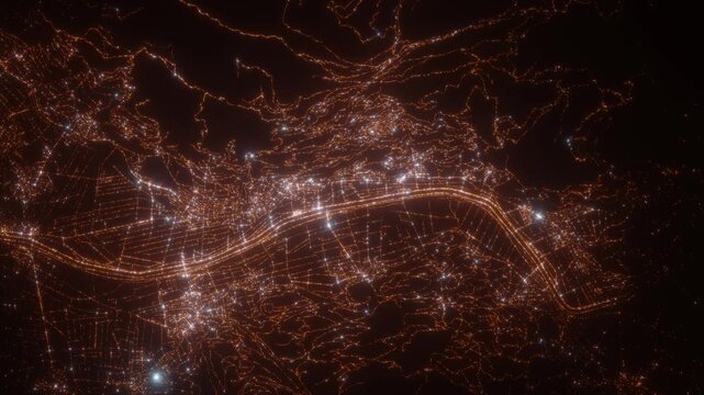 Vaduz (Liechtenstein) top view at night. Aerial view on modern city from space. Camera is flying above the city, moving forward. Vertical video. The north is on the left side