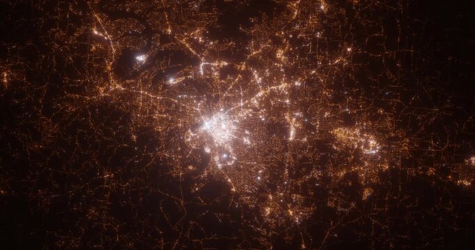 Nashville (Tennessee, USA) aerial view at night. Top view on modern city with street lights. Camera is zooming out, rotating counterclockwise. Vertical video. The north is on the left side