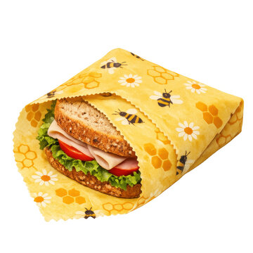 Reusable beeswax food wrap with bee print wrapped around a healthy sandwich, sustainable zero waste kitchen storage solution for food preservation, isolated on transparent background cutout.