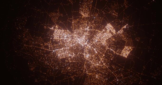 Grodno (Belarus) top view at night. Aerial view on modern city with lights. Camera is flying above the city, moving backward. Vertical video. The north is on the left side