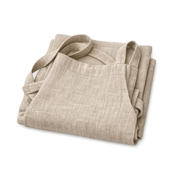 Premium folded natural linen apron with visible fabric texture, beige kitchen bib apron for cooking, baking, and gardening, high-quality textile product isolated on a transparent background.
