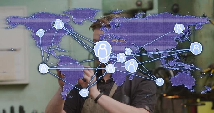 Vertical video: Technician lifting device for tech testing on bench, purple map pulsing then fading