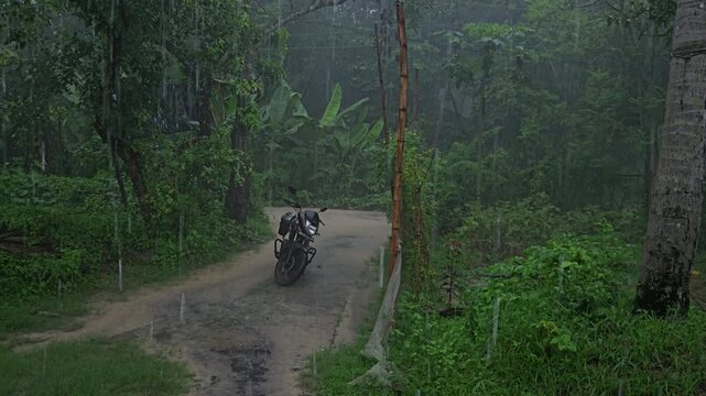 Heavy Monsoon Rainfall on Rural Village Road with Parked Motorcycle, Tropical Countryside During Rainstorm, Wet Landscape, Nature, India