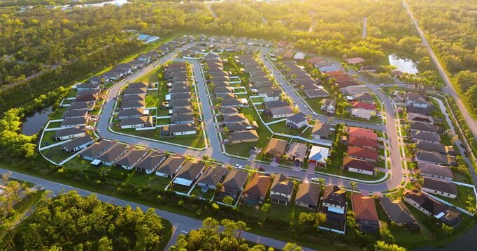 Premium housing development in the USA. Expensive houses between green palm trees in southwest Florida.