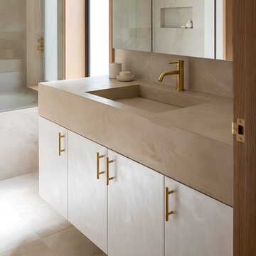 Modern minimalist bathroom vanity with micro-cement monolith sink