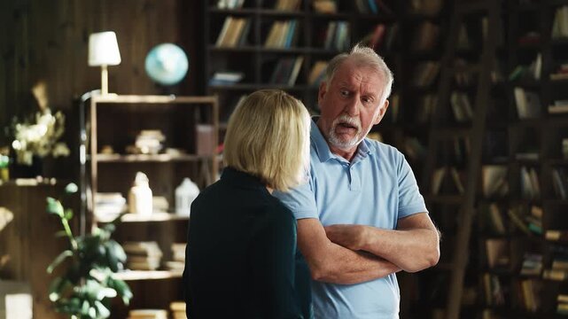 Offended senior man arguing with adult daughter, generation gap, quarrel