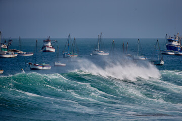 Fototapeta premium Powerful Pacific swell barrels along the iconic pier of Cabo Blanco, a legendary surf destination where pristine waves, rich fishing heritage, and authentic coastal culture come together, 