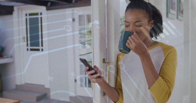 Vertical video: Sipping woman in raglan reading phone at door with mug, tech overlay, copy space