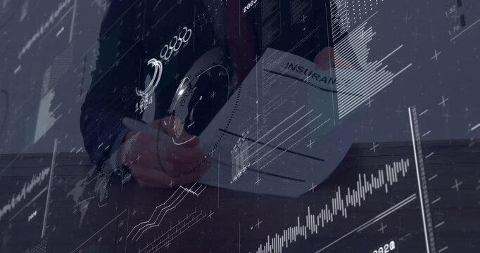 Vertical video: Reading INSURANCE, man in suit and red tie signing policy at desk with pen, charts