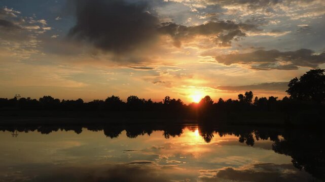 Pretty Sunset behind Lake Timelapse
