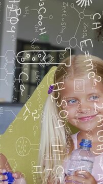 Vertical video: Cam panning showing girl drinking water hydrating smiling glancing with lab overlay