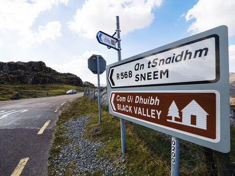 Road sign with direction to Black Valley and Sneem town in county Kerry, Ireland, Famous and popular tourist area with stunning nature scenery.