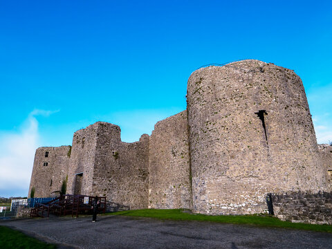 Stunning old fortress castle in Roscommon town, Ireland. Famous tourist attraction with nice green park and amazing view. Powerful stone wall and towers to protect important people. Irish history.