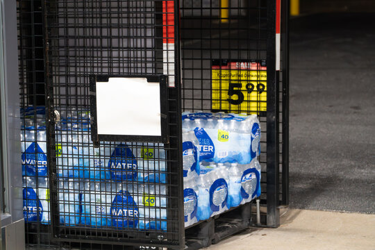 Kroger Purified Drinking Water 40-Pack Bundles in Retail Store Cage with Sale Price Display, Ready for Bulk Purchase & Hydration.