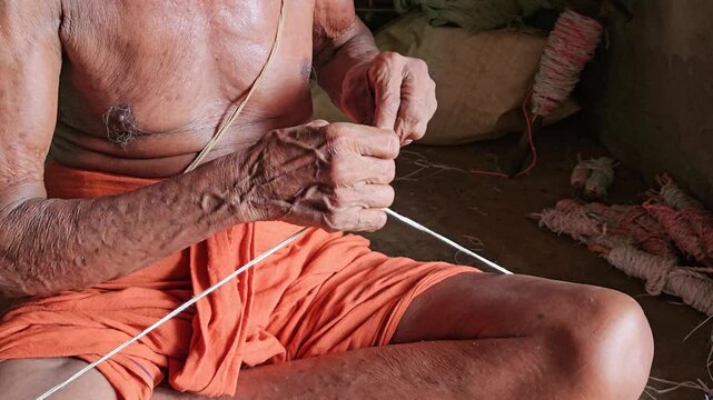 Elder Indian Brahmin Man Making Sacred Thread Janeyu, Traditional Yajnopavita Craft, Hindu Ritual Object Preparation, Cultural Heritage and Religious Practice Documentary 4K