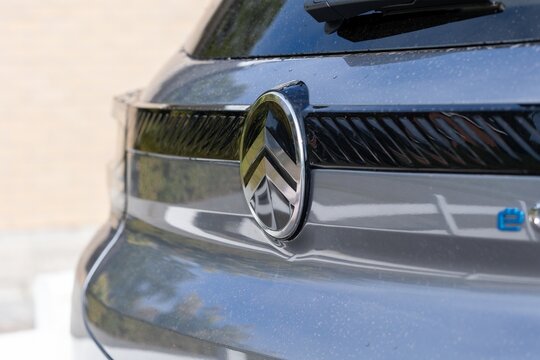 Brecht Belgium - 10 October 2025: Detailed view of Citro&euml;n badge on wet metallic grille, emphasizing texture, shine, and raindrops&mdash;great for automotive, luxury vehicle, and close-up photography use.