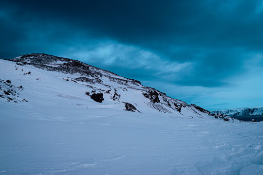 Dramatic Winter Mountain Landscape with Dark Sky. Finnmark, Norway