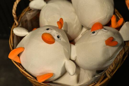 Easter holiday. Cute Easter chicks in a wicker basket at a decor store.