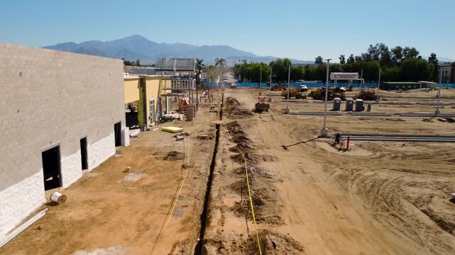 Aerial View of Automotive Dealership Construction Site with Steel Structure and Metal Roof