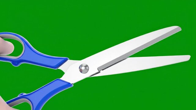 Close-up of blue scissors opening and closing in front of a green screen background for video editing or cut-out purposes
