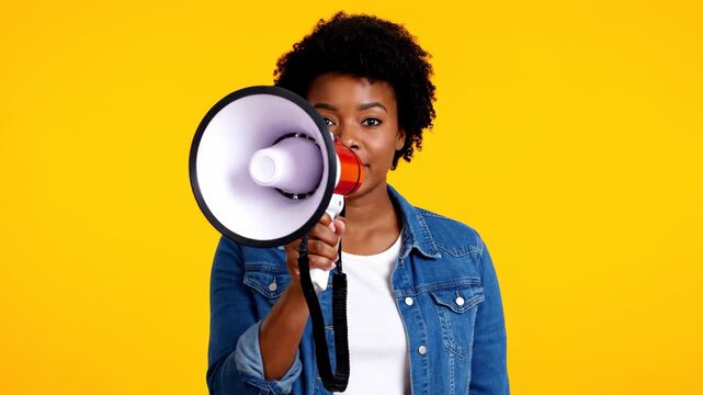 Young african american woman uses a megaphone for an important announcement. Sequence showing a progression from serious to speaking out and then smiling with satisfaction
