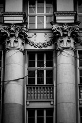 Ornate Corinthian columns and floral garland on Kraków tenement facade © Lukasz Czajkowski