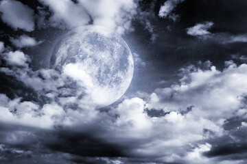 Fototapeta premium Big full moon among clouds in night sky