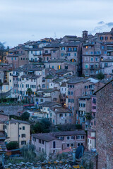 Naklejka premium Sunset Bathes Siena In Warm Golden Hues. City Of Siena Is Illuminated By Radiant Sunset Casting Golden Reflections On Its Rooftops