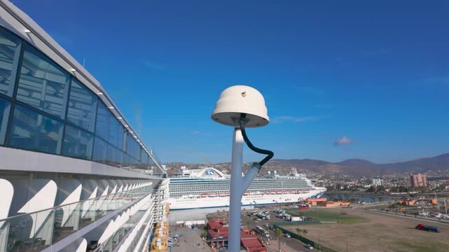  Ensenada, BC, Mexico: March 19, 2026 - Cruise ship deck with maritime radome navigation sensor