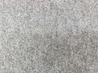 Fototapeta premium Close-up textured abstract background of soft grey speckled material for design and decor