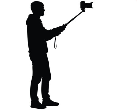 Vector silhouette of a man taking a selfie with a monopod