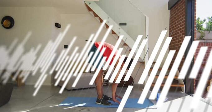 Man doing forward fold from standing on blue mat, diagonal overlay sweeping over body for fitness