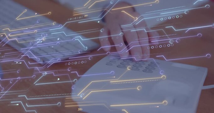 Hands moving from keyboard after typing, pressing telephone keys to place call with circuit overlay