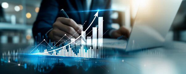 Businessman using laptop analyzing sales data and economic growth graph chart, Business strategy and planning, marketing report, business development concept. © Benjamin